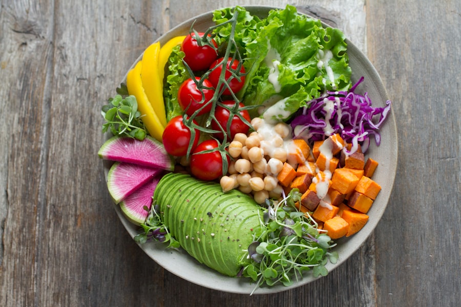 A nourishing bowl of chickpeas, avocado, sweet potato and fresh vegetables